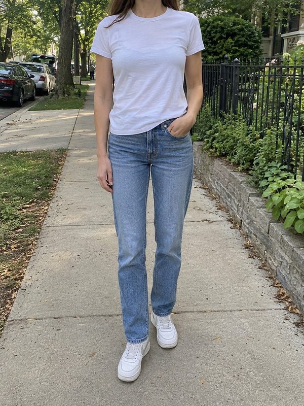 Example outfit cropped below the face: a white crew-neck t-shirt, light-wash straight jeans and white sneakers.